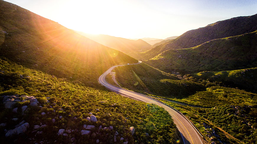 Winding Mountain Road at Golden Hour Sunrise