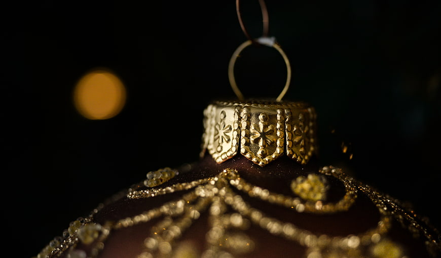 Close-up of Gold Christmas Ornament with Snowflake Details