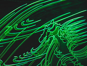 Abstract Green Neon Light Trails on Dark Background