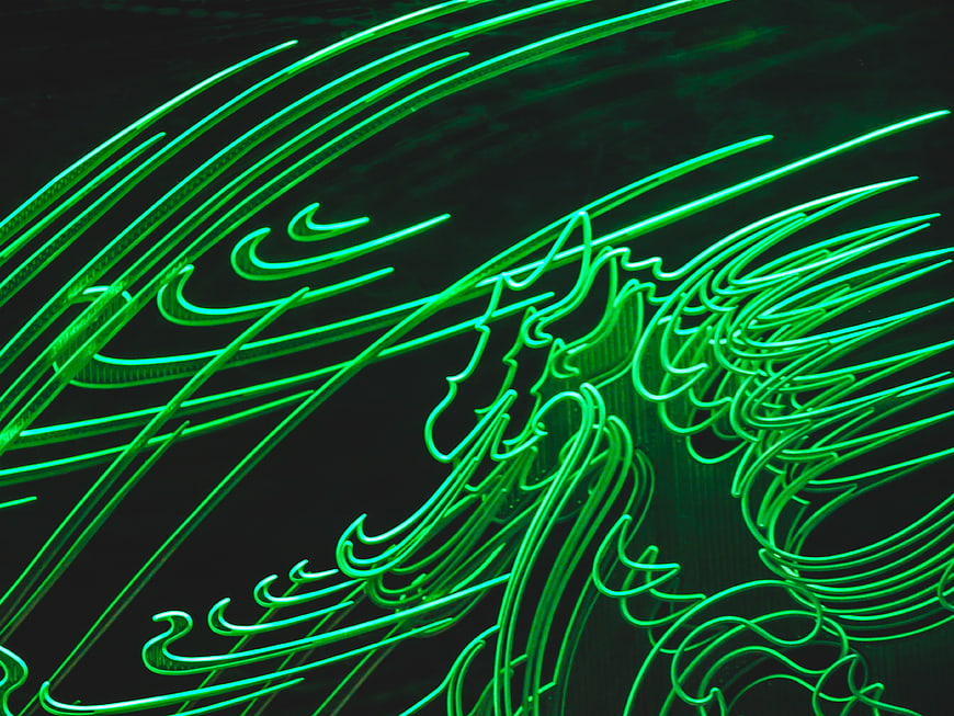 Abstract Green Neon Light Trails on Dark Background