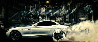 White sports car drifting with smoke in neon city street