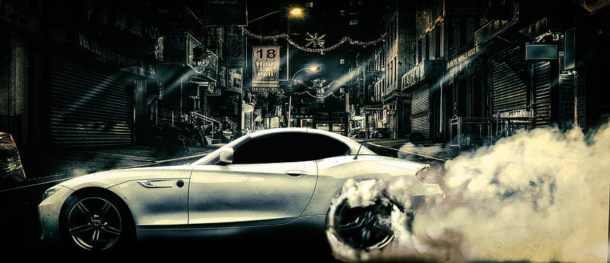 White sports car drifting with smoke in neon city street