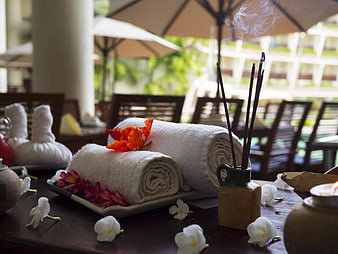 Rolled Spa Towels with Flowers and Incense