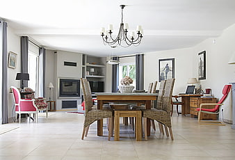 Spacious Modern Dining Room with Wooden Table and Wicker Chairs