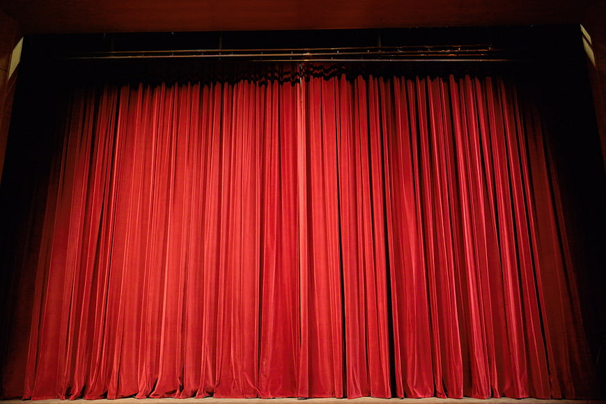 Closed Red Velvet Theater Curtain On Stage