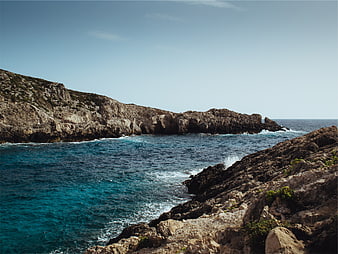 Rugged Rocky Coastline with Turquoise Ocean Waves