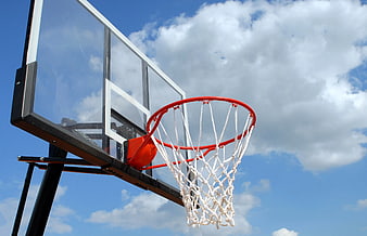 Outdoor Basketball Hoop Against Blue Sky