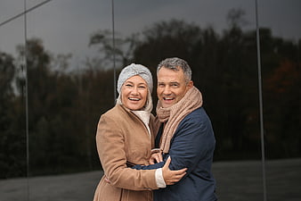 Happy Senior Couple Embracing in Autumn Fashion