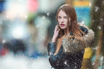 Woman in Winter Coat Standing in Snow