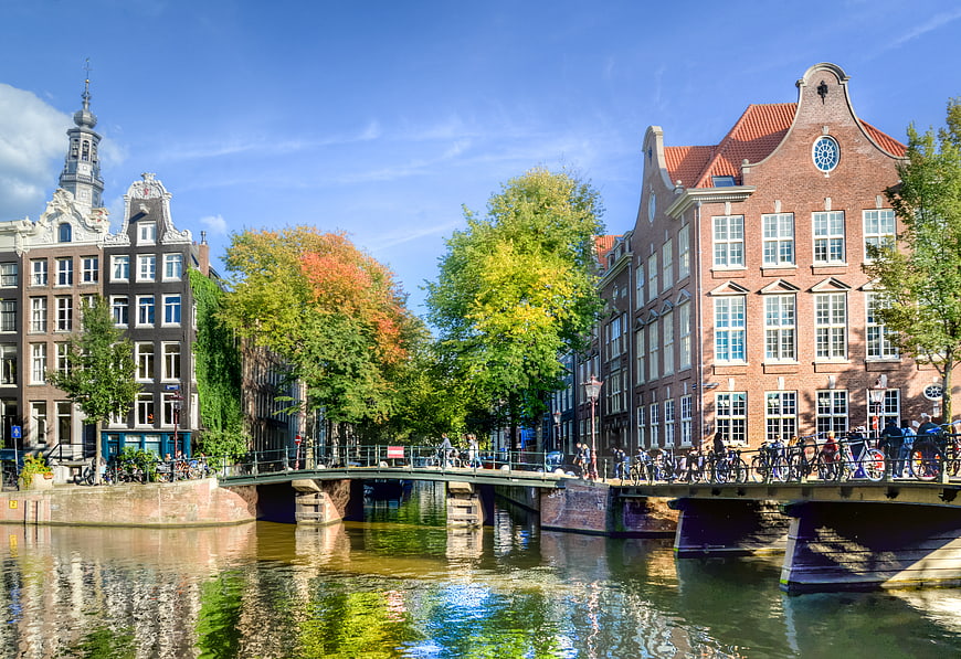 Amsterdam Canal Scene with Historic Buildings and Bridge