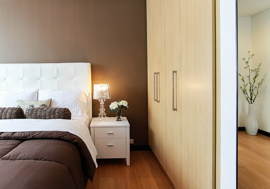 Modern Bedroom Interior with White Bed and Wooden Wardrobe