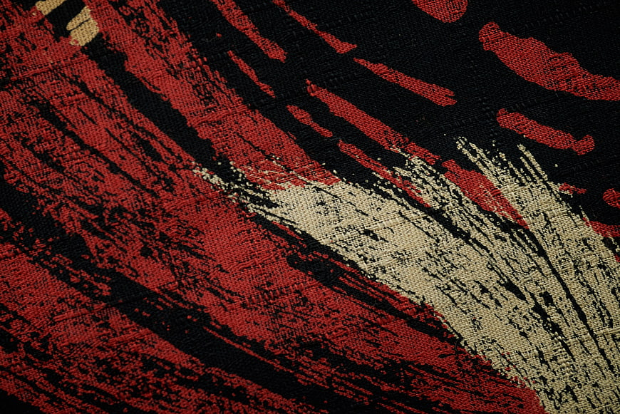 Abstract Red Black and Beige Woven Fabric Texture