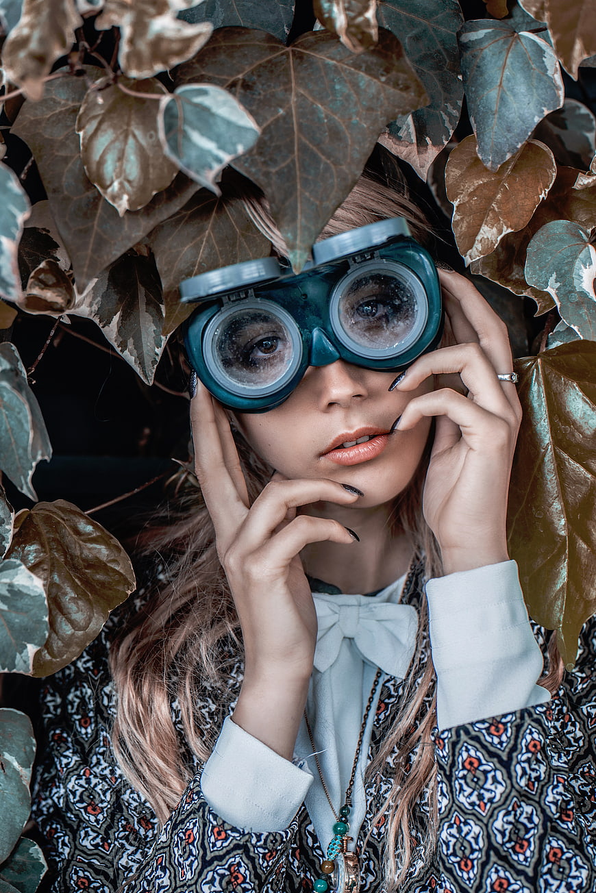 Woman with Steampunk Goggles Surrounded by Ivy Leaves