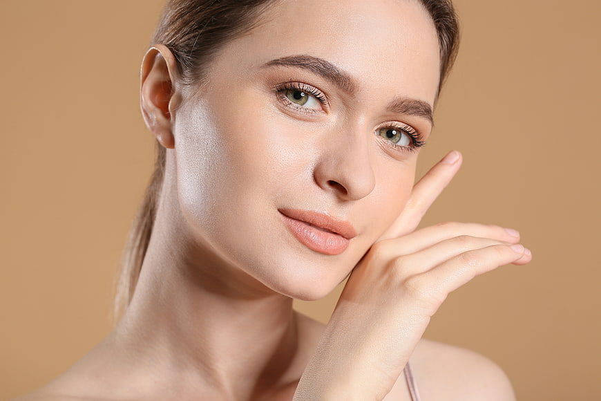 Close-up portrait of beautiful woman with fresh skin