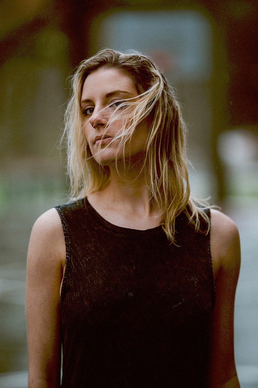 Cinematic portrait of blonde woman with windblown hair