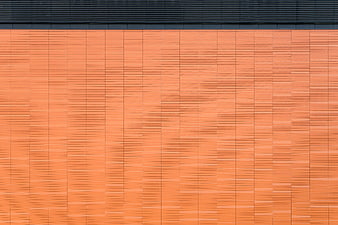 Abstract Orange Brick Wall Texture with Black Roof