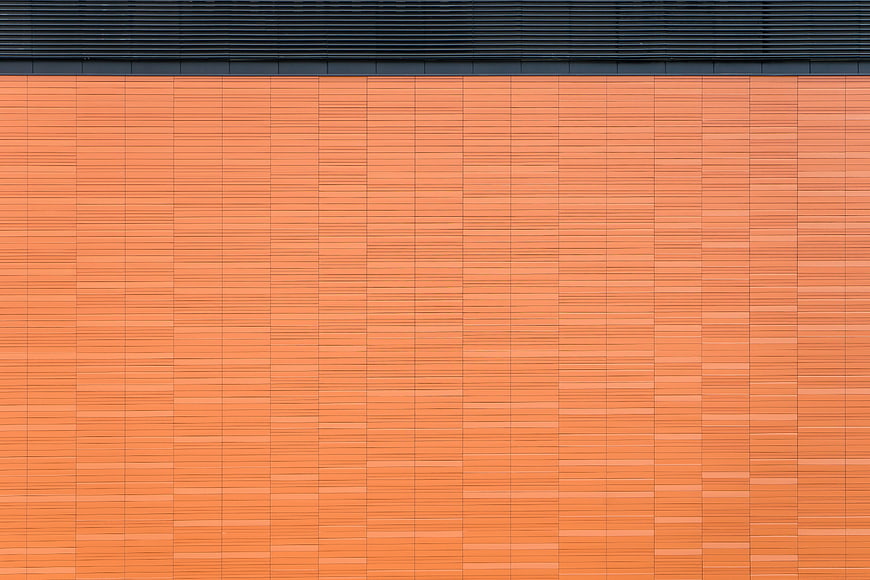 Abstract Orange Brick Wall Texture with Black Roof