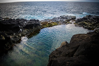 Natural Rock Pool with Clear Blue Water and Ocean Waves