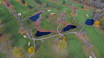 Aerial View of Golf Course with Autumn Foliage and Ponds