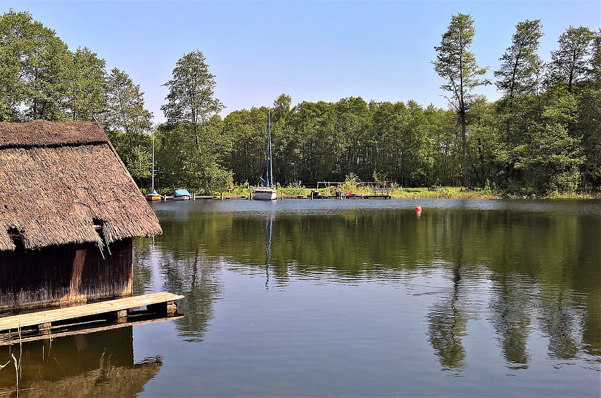 Thatched Boat House On Calm Lake Schaalsee In Northern Germany