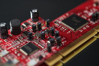 Close-up of red computer graphics card circuit board
