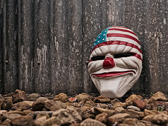 Creepy American Flag Clown Mask on Rocks