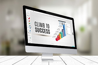 Computer monitor displaying climb to success presentation