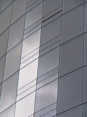 Modern Glass Building Facade with Geometric Patterns