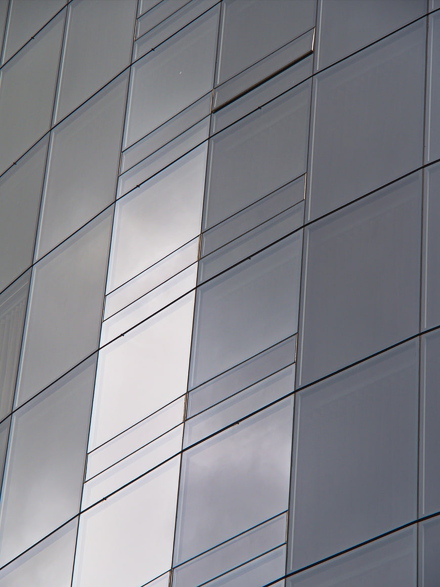 Modern Glass Building Facade with Geometric Patterns