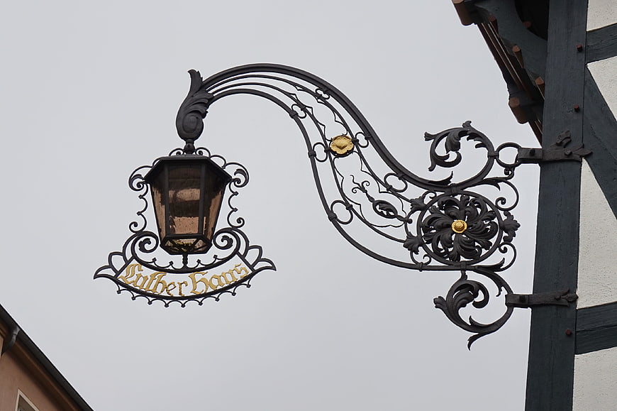 Ornate wrought iron sign for Luther Haus in Eisenach, Germany