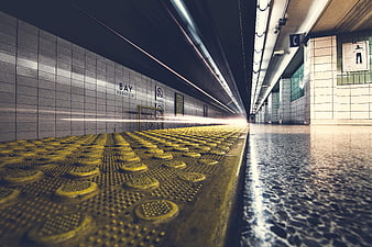 Low angle view of Yorkville subway station platform with motion blur