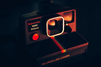 Vintage Polaroid Supercolor 1000 Deluxe Camera in Dark Moody Lighting