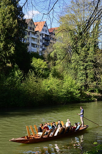 Traditional Stockkahn boat ride on the Neckar river in Tübingen, Germany