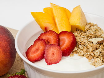 Healthy Yogurt Bowl with Granola, Strawberries, and Peaches