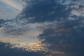 Dramatic Cloudy Sky at Dusk with Golden Light
