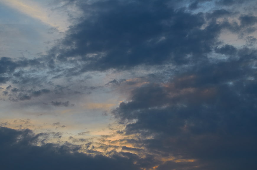 Dramatic Cloudy Sky at Dusk with Golden Light