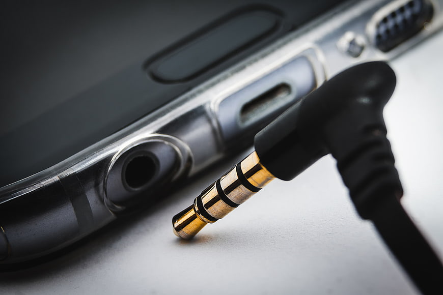 Close-up of 3.5mm headphone jack and smartphone audio port