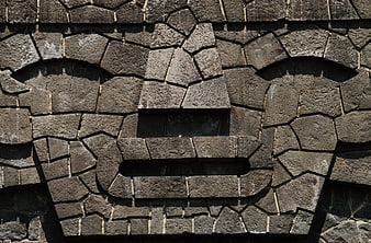 Stone Face Sculpture on University City UNAM Wall
