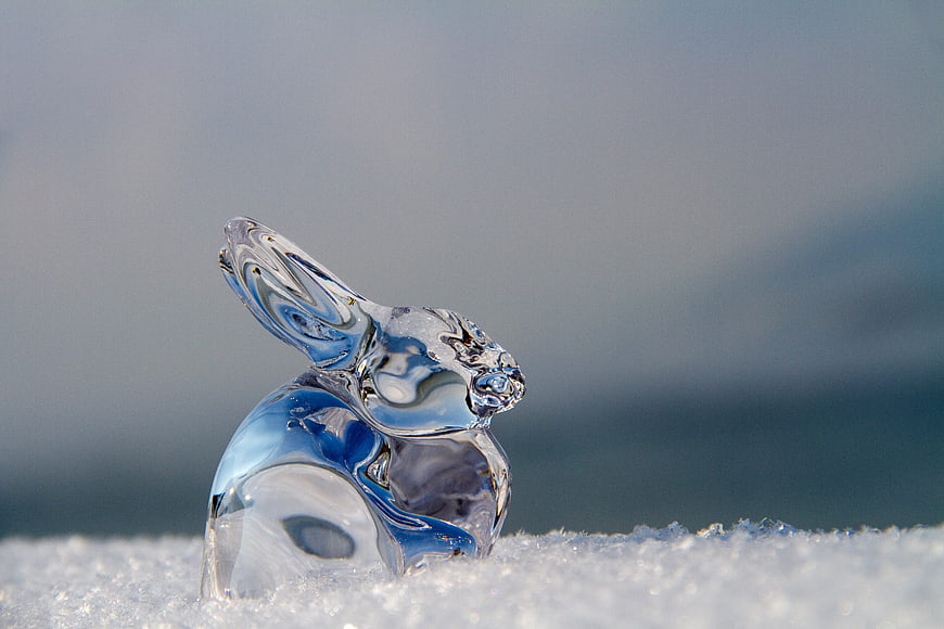 Glass Easter Bunny Sculpture on Snow