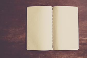 Open blank notebook on dark wooden table top view
