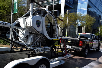 Houston Police Autogyro and Pickup Truck Parked on City Street
