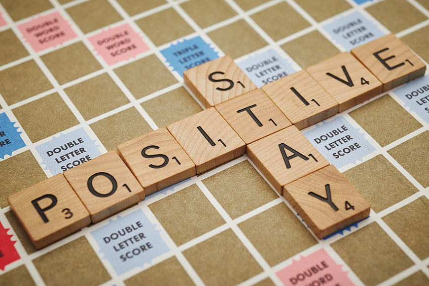 Positive Stay Word Scrabble Tiles on Game Board
