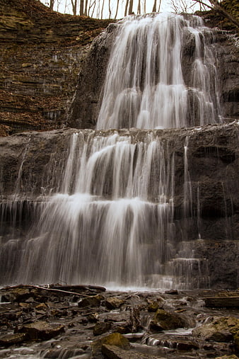 Long Exposure Waterfall Cascading Over Rocky Cliffs