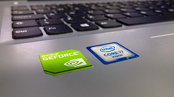 Close-up of NVIDIA GeForce and Intel Core i7 stickers on laptop