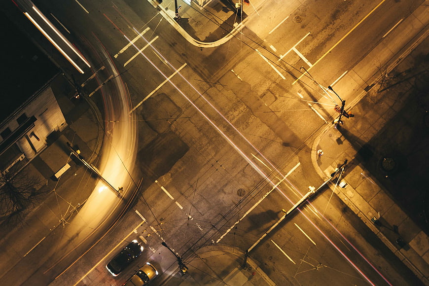 Aerial Night View of City Street with Car Light Trails