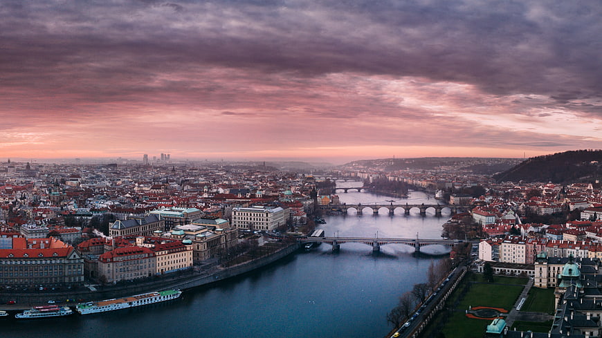 Panoramic View of Prague Cityscape and Vltava River at Sunset
