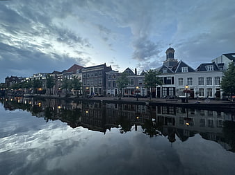 Dramatic Canal Reflection in Dutch Town at Dusk