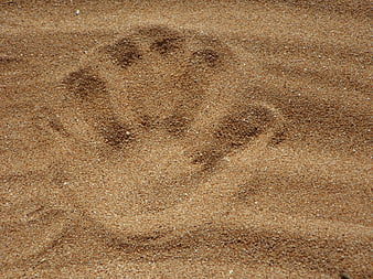Human Handprint in Sand Texture