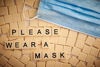Please Wear a Mask Message with Scrabble Tiles and Blue Surgical Mask