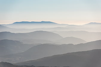 Misty Mountain Layers in Soft Morning Light